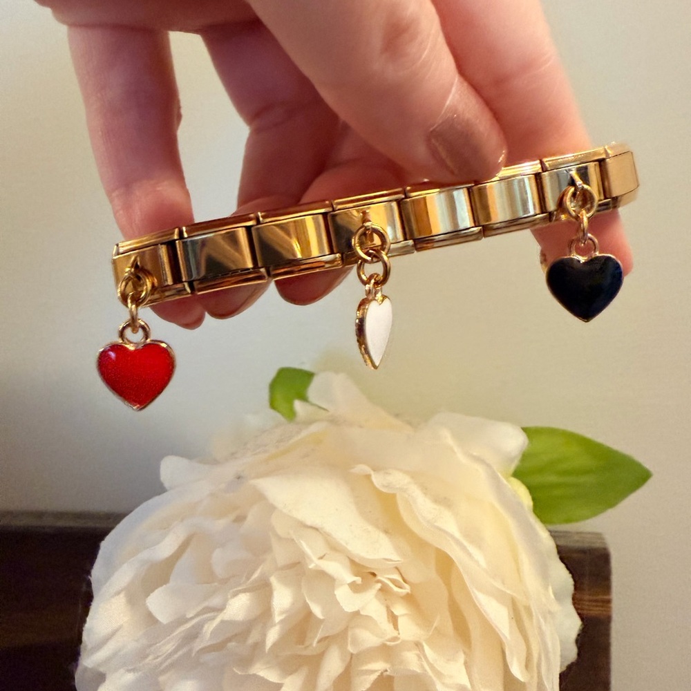 Hearts of four Gold Tone Italian Charm Bracelet